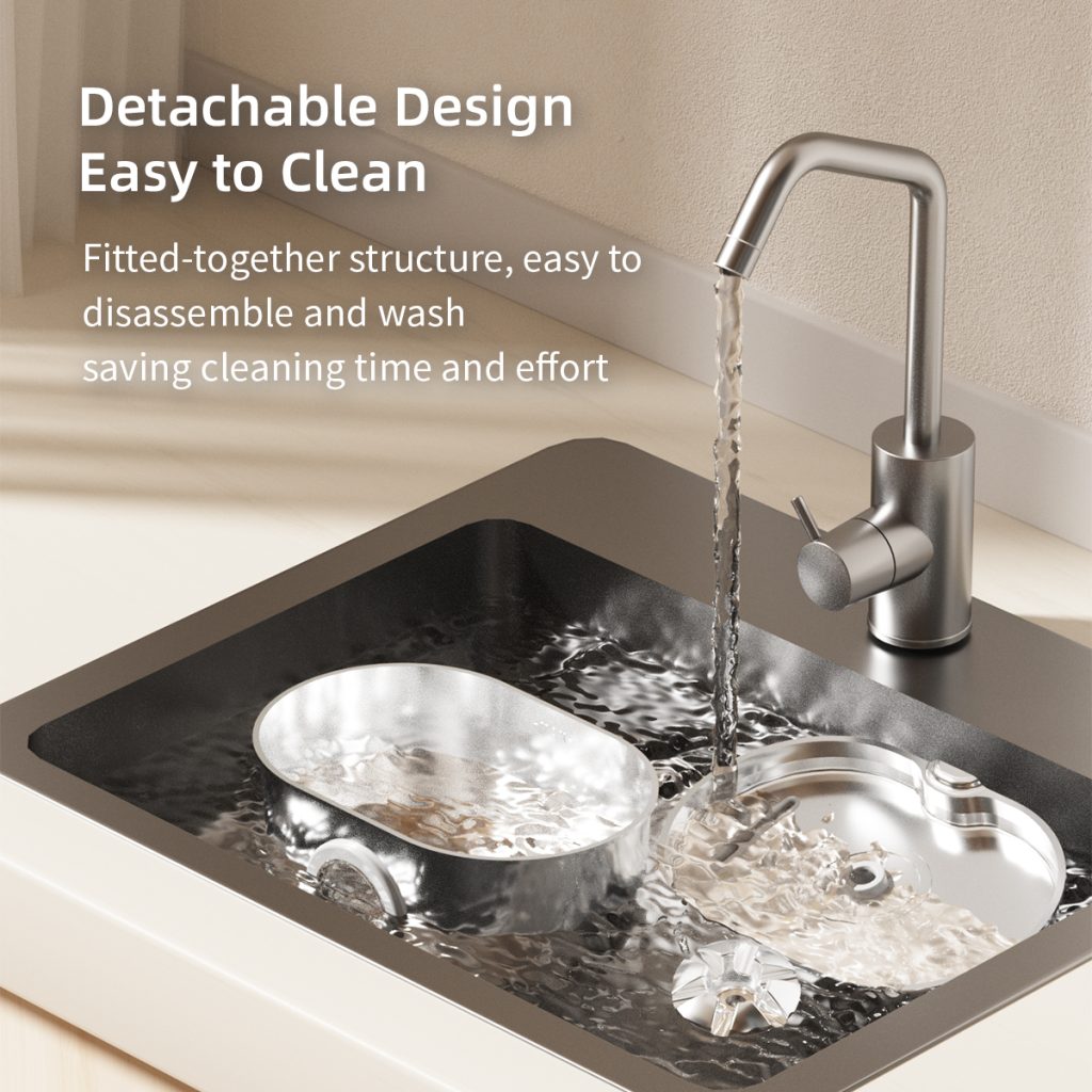 Modern stainless steel kitchen sink with a detachable design; water flows from a curved faucet onto dishes in a shallow basin.
